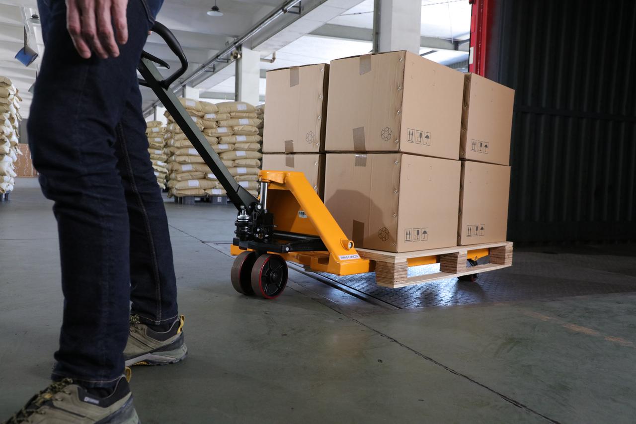 Man Using Hand Jack What You Should Know About Hand Pallet Jacks